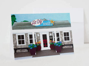 Paper cut depiction of the outside of the Art Cliff Diner