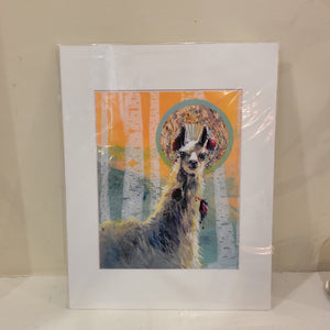A matted print of a llama with white birch trees behind it.