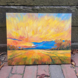 An oil painting of a golden sunset across a yellow and green field.