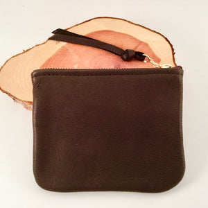 A chocolate large leather zip pouch.