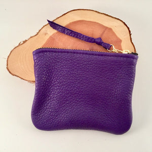 A purple large leather zip pouch..
