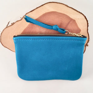 A turquoise  large leather zip pouch..