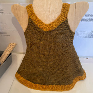 A v-neck brown dress with yellow outline on the top and bottom