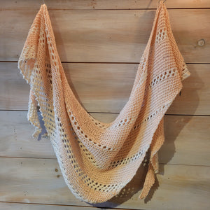 The scarf is a combition of pale peach and white.