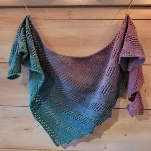 This scarf has an ombre effect that transitions turquoise to blue to purple to pink.