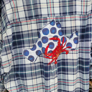 A blue and red plaid flannel with a poka dot island and a red crab