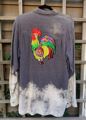 A bleached flannel with a bright chicken on the back
