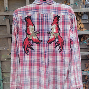 A red plaid flannel with two red tailed birds