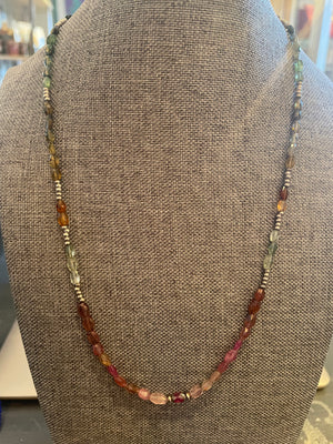 A rainbow earth toned beaded necklace.