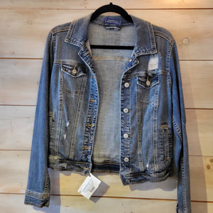 The front of a denim jacket