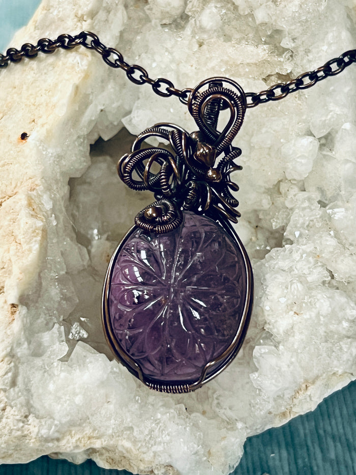 Copper Wrapped Carved Amethyst Pendent