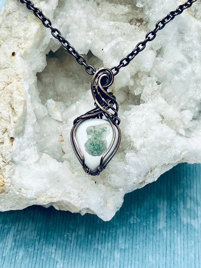 Copper Wrapped Solar Eye Moss Agate Pendent