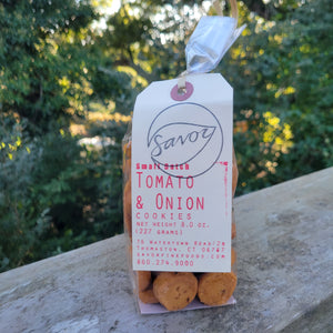A bag of tomato and onion flavored small cookies.