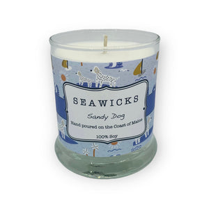Sandy Dog scented candle with blue and yellow boat and dogimagery on the label