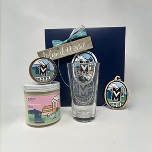 Deep blue gift box from Martha's Vineyard with candles and etched glass.