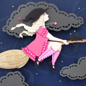 A blond witch and a black cat on top of a broom stick flying through the night sky.