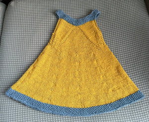 A v-neck shape yellow dress with blue trim