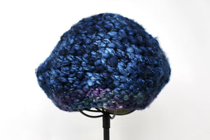 This is a dark blue beret with a touch of purple