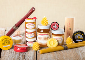 Island Bee Company products including Raw Honey, Beeswax candles, Emollient Bars, Lip Balm, and Ointment 