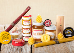   Island Bee Company products including Raw Honey, Beeswax candles, Emollient Bars, Lip Balm, and Ointment  