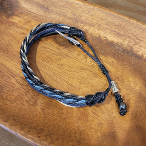 A dark blue twisted rope bracelet