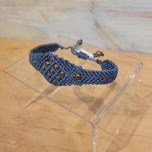 A blue woven bracelet