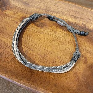 A gray twisted rope bracelet