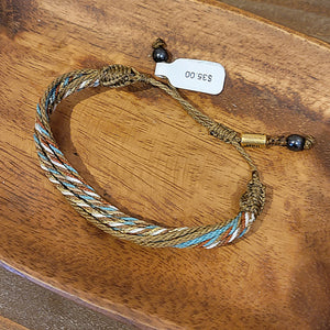 A light brown and blue twisted rope bracelet