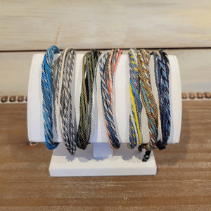 Handmade with intention by Rumi Sumaq, each bracelet features a cluster of woven rope. Available in a selection of colors and adjustable to 9.5 inches.