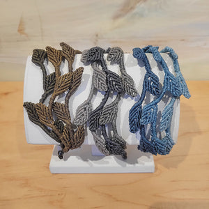 Woven macramé bracelets handmade by Rumi Sumaq. Available in three different color combinations and an adjustable tie, making it great for any size wrists. (10 in and smaller)