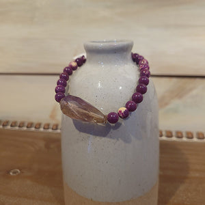 Handmade by Susan Balaban Designs featuring Ametrine stone beads. The bracelet is 8 inches.